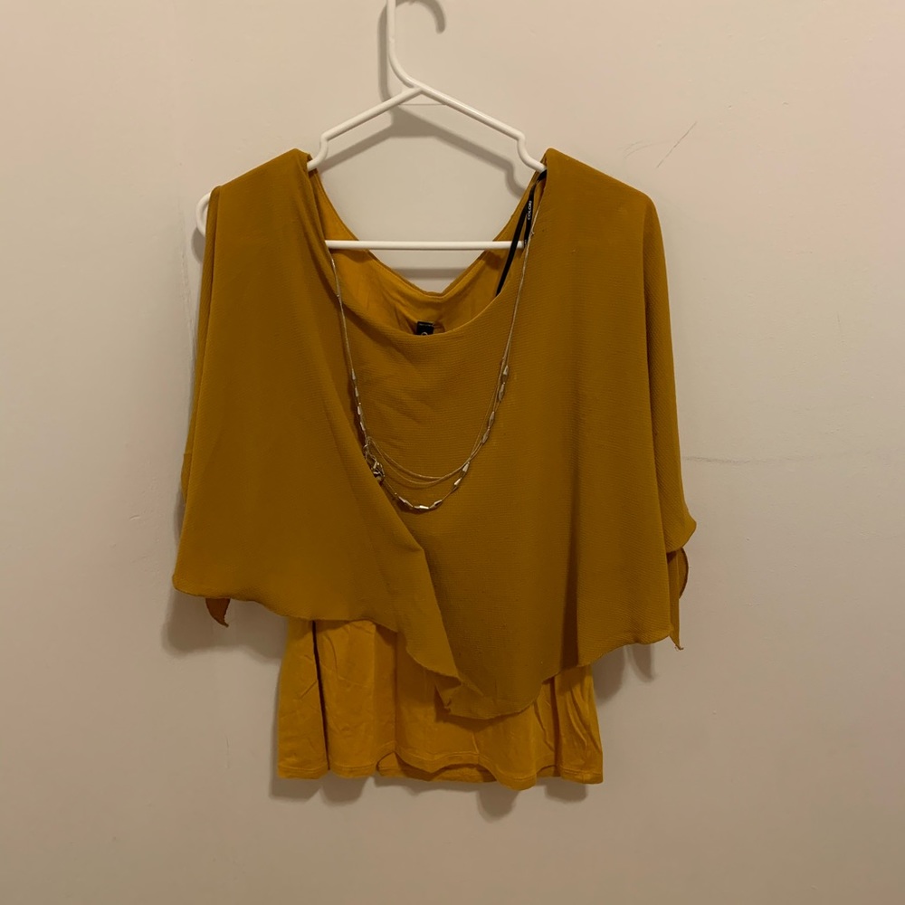 Yellow shirt with incrusted jewelry